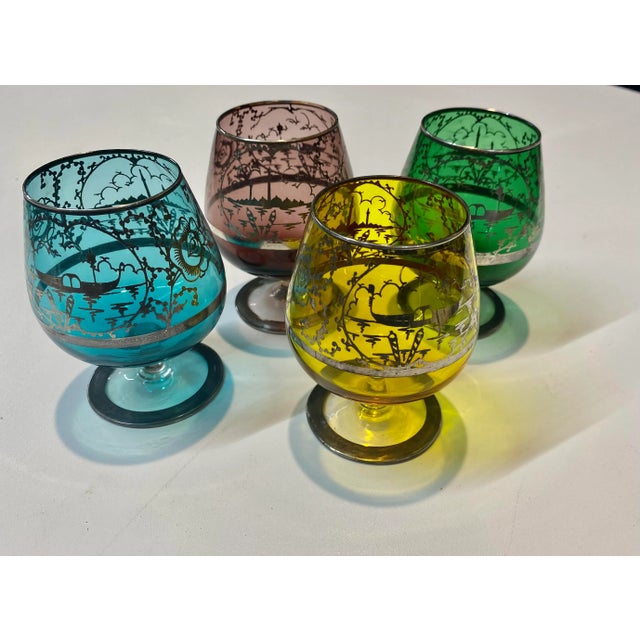 Murano exquisite set of four silver decorated, colored glass with Italian Venetian motif cognac coupes. Made in Italy....