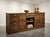 An exceptional and highly functional French apothecary counter (meuble de métier / comptoir de pharmacie), dating from...