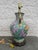 Hand painted porcelain lamp with wood cap and base manufactured by Fredrick Cooper, Chicago. The lamp retains its original...