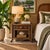 Charming vintage coastal nightstand crafted from natural bamboo and woven wicker, featuring a single drawer with a...