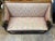 An antique Swedish Empire or Gustavian style settee dating to the late 19th century. It has a structured, straight high...