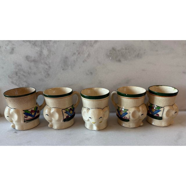 Set of 5 unique small hand painted ceramic mugs in the shape of an elephant wearing a riding blanket. Made in Japan and...