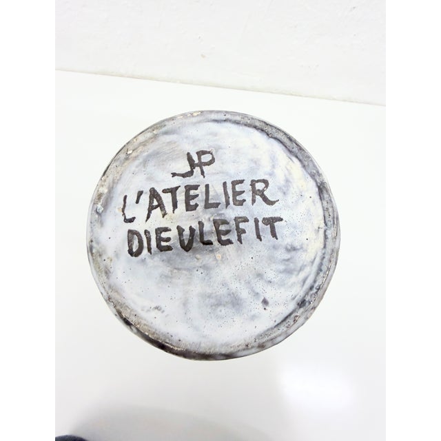 Large cylindrical vase from the 1960s, made by the Dieulefit studio, designed by Jacques Pouchain, marked on the bottom....
