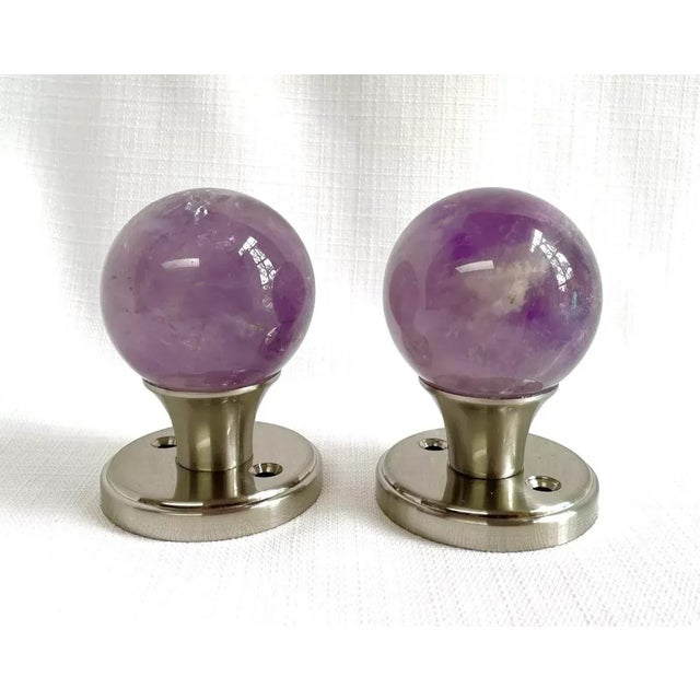 Add the calming serene energy of amethyst to your space with this beautiful door knob set. The polished round amethyst...