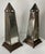 Antique mirror obelisks with metal pedestal base. Obelisks feature a hidden hinged door at one side for the insertion of...