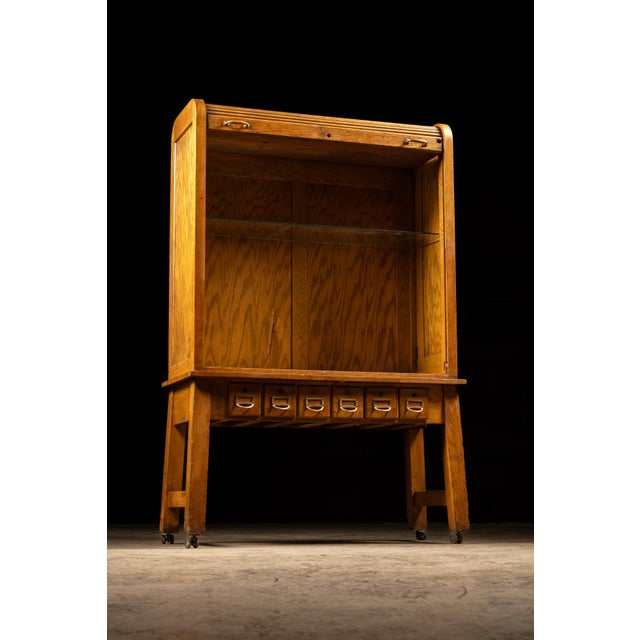 c. 1940s; Wiese Laboratory Furniture Co. - Manitowoc, WI Vintage scientific storage cabinet with rolling door. This piece...