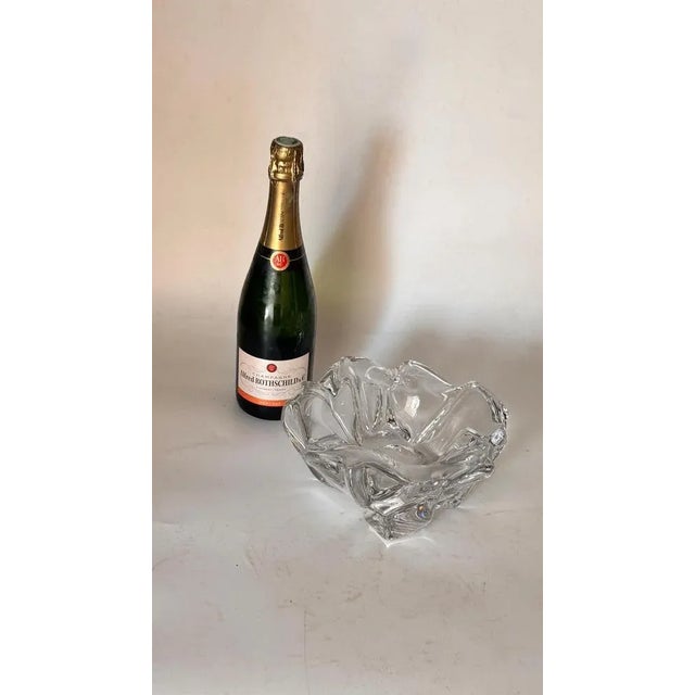 This is a large daum ashtray made in france around the 1960s. Crafted in clear crystal, it features a freeform organic...