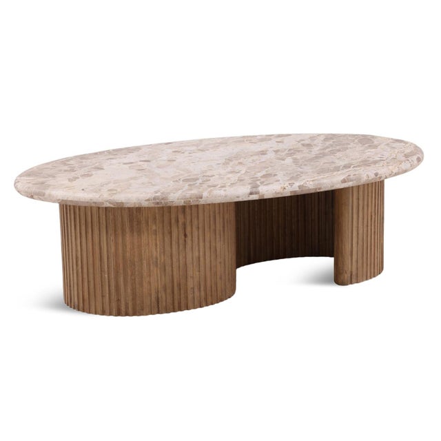 This coffee table brings sculptural warmth and natural texture to the living space with a softly rounded Tendu marble top...