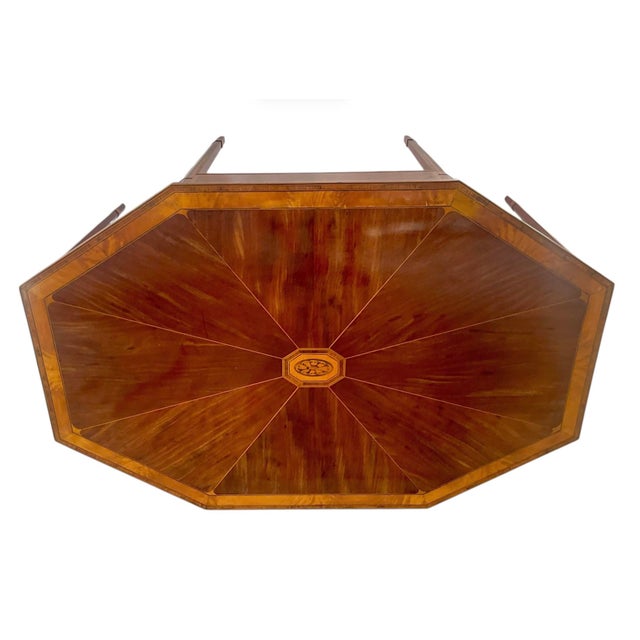 Georgian Inlaid Octagonal Center Table. The octagonal top features an intricate central marquetry reserve with radiating...