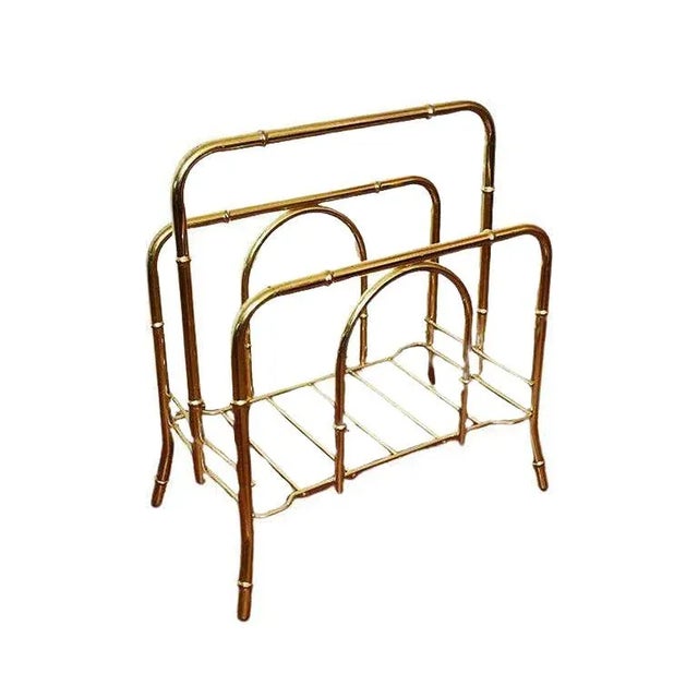 An eye-catching Hollywood Regency bamboo magazine rack. Perfect for storing magazines or treasured books. This beauty...