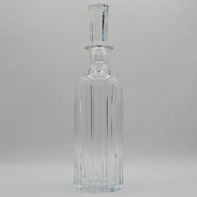 This Baccarat crystal Harmonie Decanter has a trim, streamlined silhouette. Consecutive parallel lines travel cleanly...