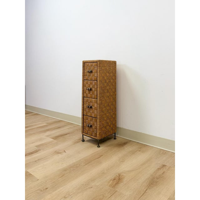 This charming vintage wicker parquetry narrow apothecary chest is a beautifully crafted and highly functional coastal...