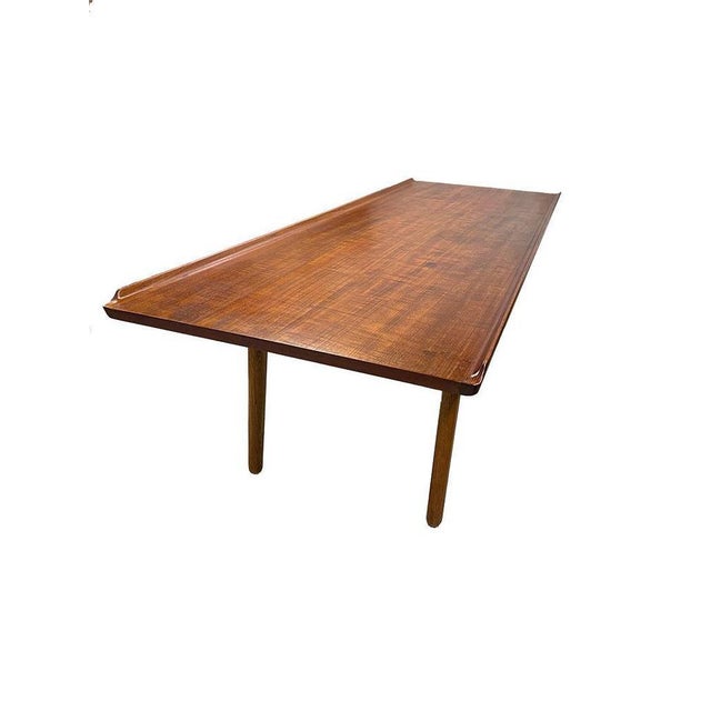Coffee table by Aksel Bender Madsen for Bovenkamp, ​​1950s A low elongated coffee table made of teak with organic raised...