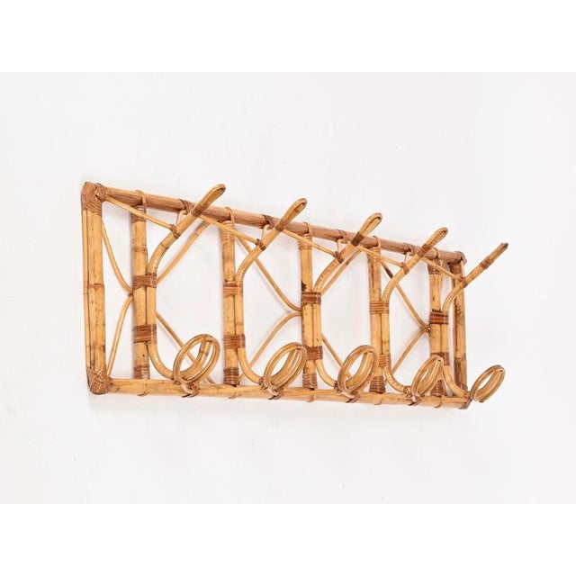 Gorgeous and very unique extra-large wall-mounted coat rack fully made of bamboo, curved rattan, and hand-woven wicker....