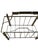 A polished brass magazine rack in the faux-bamboo style that never really left — segmented posts, a graceful arched...