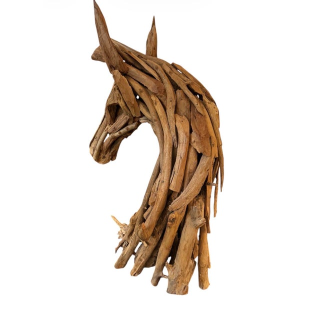 A striking 42-inch handcrafted horse head sculpture, artfully composed of natural driftwood and reclaimed wood fragments....