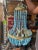 Gorgeous empire shape chandelier with beautiful blue beading. During the day it shines brilliantly and at night casts a...