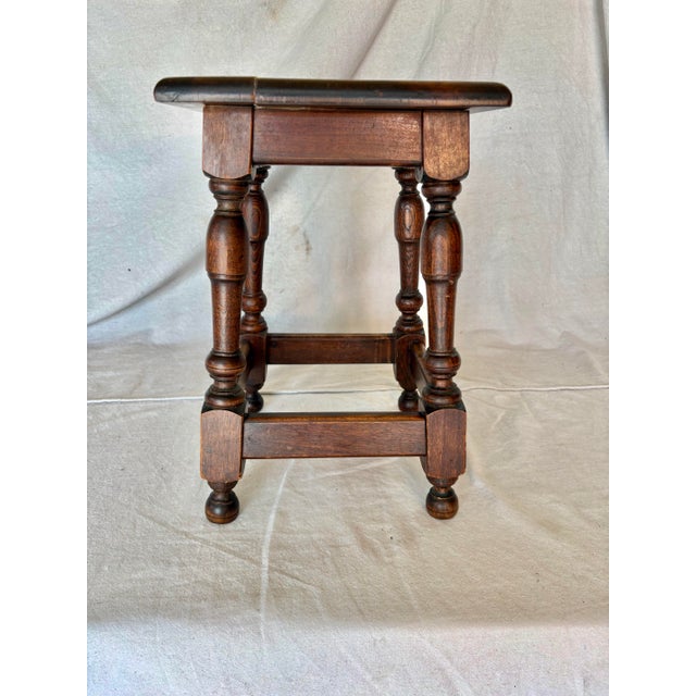 Found in the South of France, this 20th Century French Walnut Stool dates back to the early 1900's. The piece features a...