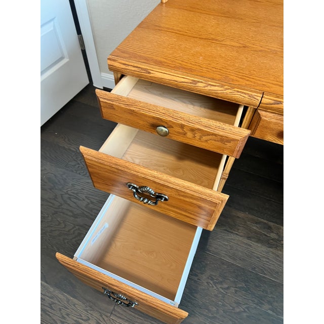 This desk was built by the Palliser Furniture company in Manitoba, Canada. It provides great storage for files and all...