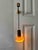 A unique Scandinavian mid-century sconce from the 1950s, featuring a charming combination of brass, wood, and glass. This...