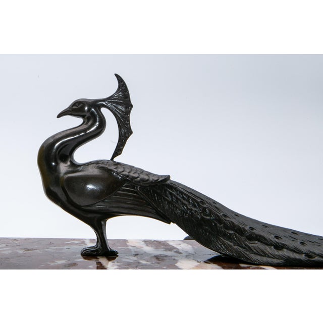Art Deco figurative table lamp from France in very good condition for its age. The combination of marble, the peacock...