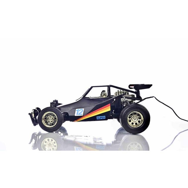 A detailed scale model of the iconic brabham bt52 formula one racing car, finished in the striking black and white...