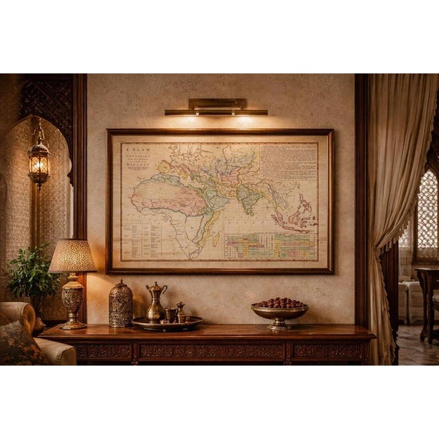 This finely engraved and delicately hand-colored map presents a sweeping view of the Islamic world as understood in early...