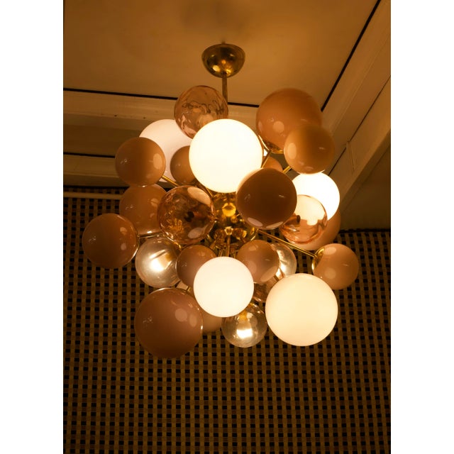 Exciting pastel pink color for this Murano chandelier, several shades together for this beautiful color. Note the...