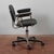 This vintage office chair is an example of functional period design, characterized by clean lines and a sturdy structure....