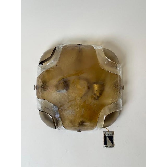 A beautiful vintage wall or ceiling light by kaiser leuchten, germany, circa 1970s. The fixture features a sculptural...