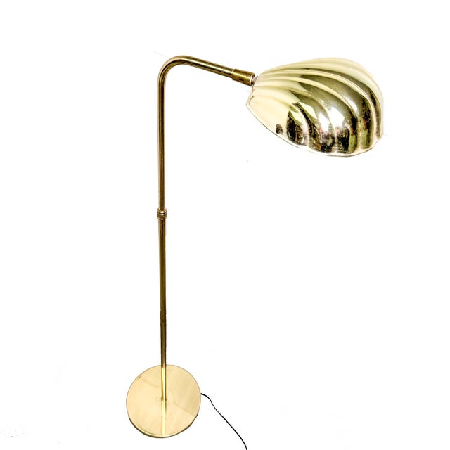 Ooh la la.... check out this ultra mid century glam brass clam shell floor lamp! The bottom has a sturdy brass base. The...