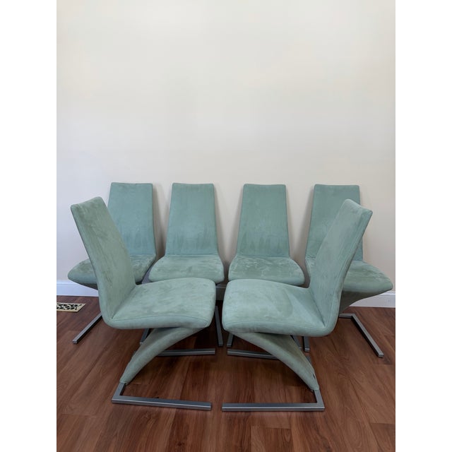 Set of six Rolf Benz Model 7800 cantilever dining chairs, showcasing refined German modern design with a sculptural,...