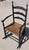 19thc Original black painted ladder back rocking chair with paddle arms.This chair is strong and sturdy...