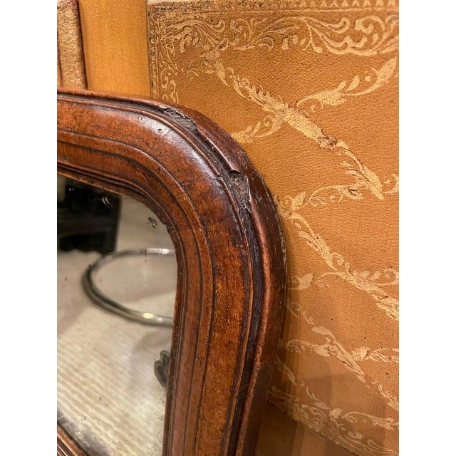 Sweet little carved walnut 17th century English Jacobean period mirror frame with the original glass. This simple small...