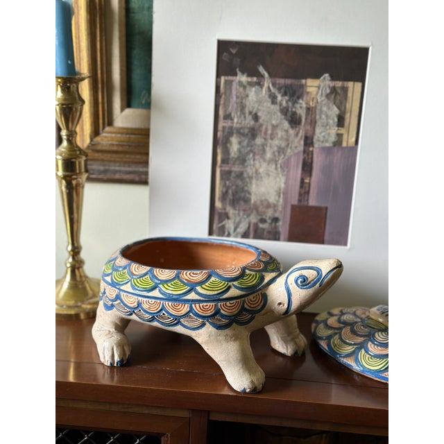 An authentic vintage hand-painted Mexican folk art terracotta turtle tureen / covered dish, originating from the renowned...