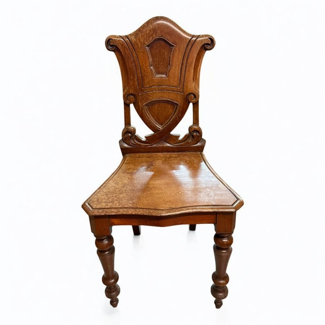 Refined Victorian hall chair . Hand crafted from mahogany with an elegantly shaped back. Dimensions: 36″ h x 18″ W – Seat...
