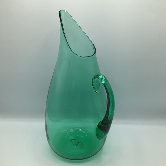 Large stunning teal hand blown mid century modern Blenko pitcher designed by Winslow Anderson.