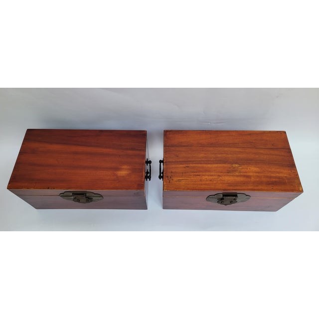 This pair of camphor storage boxes has its original lacquer finish. The construction is of standard mortise and tenon...