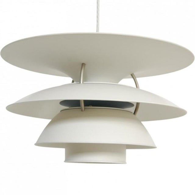 Poul henningsen ph5/4 charlottenborg lamp with white metal shades. The lamp is from the 1990s and appears in good...