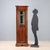 Arte Povera corner cabinet in walnut-stained fir. Glass door with a glass top and lower panel, three internal shelves, and...