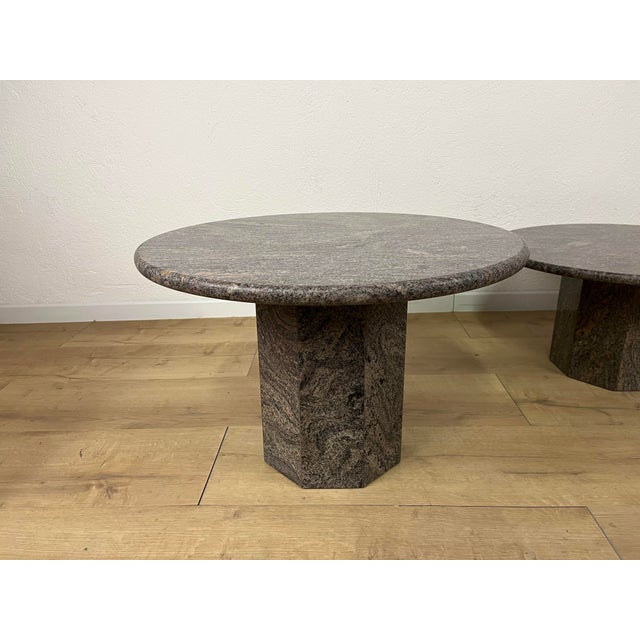 Pair of coffee tables with octagonal granite bases and round granite tops, Italian-made in the 1970s. The tables have been...