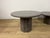 Pair of coffee tables with octagonal granite bases and round granite tops, Italian-made in the 1970s. The tables have been...