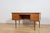 This desk was made in the 1960s by the Danish manufacturer Edmund Jørgensen. It's crafted from teak with contoured...