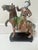 Chinese tang sancai glazed horse riding figure dominated by rich molted green and reddish brown tones
