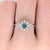 A rare blue diamond glows with a rare fancy blue at the centre of this solid 14K white gold ring. A fancy blue is among...