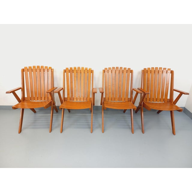 Four vintage garden armchairs from the 1960s, Scandinavian style, made of beech wood with brass details, in very good...