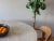 One of a kind Postmodern Italian designer 1970s off white round Solid travertine dining table with sculptural pedestal...
