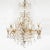 Traditional gilt metal chandelier with curvilinear tendril motif and crystal drop elements. Origin: United States Circa:...