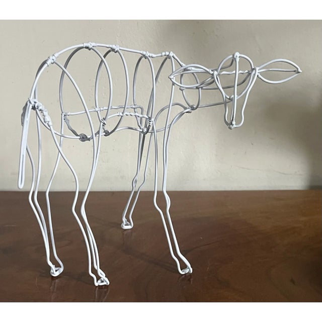 Modernist wire sculpture of standing deer. Captures the grace and musculature of the animal. Well balanced and strong wire...