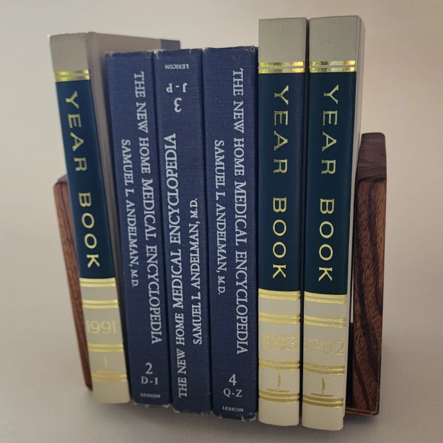 Set of two inlaid multi-wood mosaic bookends by Wildwood. They go great with many types of books, decors.